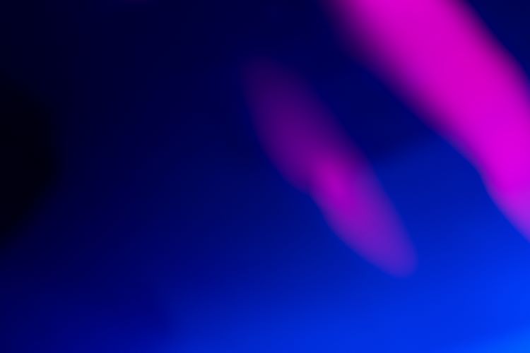 A blue and purple blur on a black background