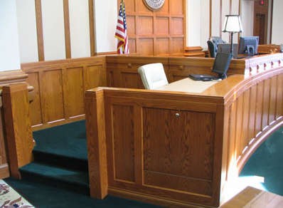 A witness box in a courtroom