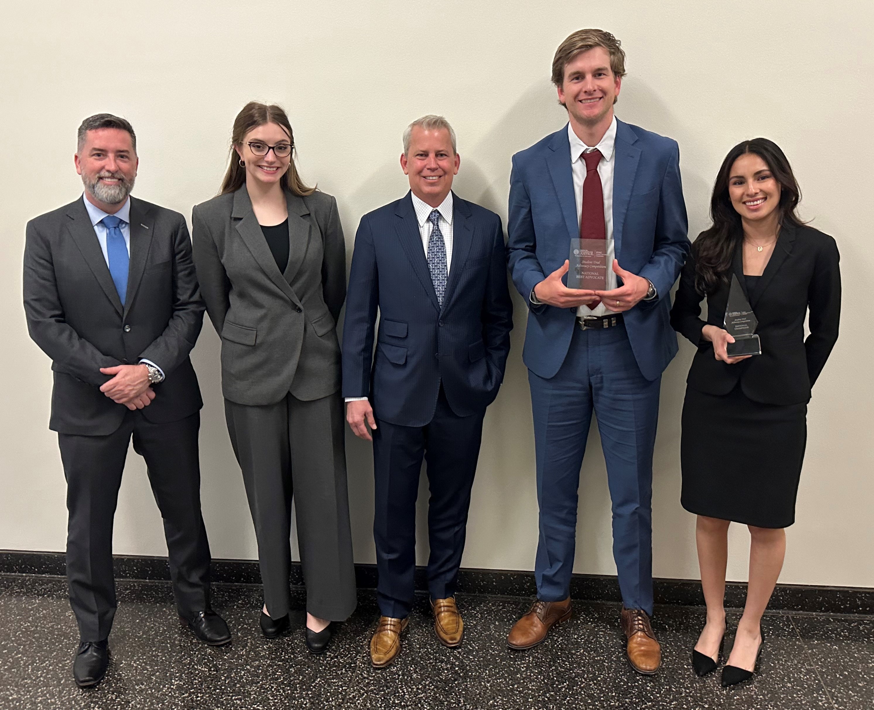 2024 STAC Winners Baylor University holding their awards and standing with AAJ President Sean Domnick